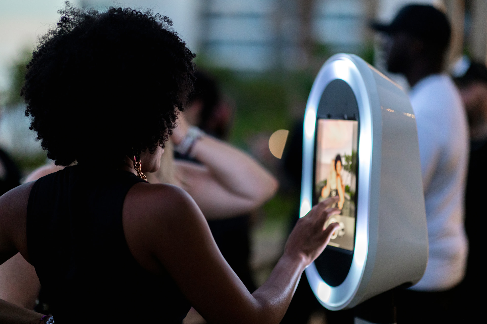 Guest using a modern photo booth at an event