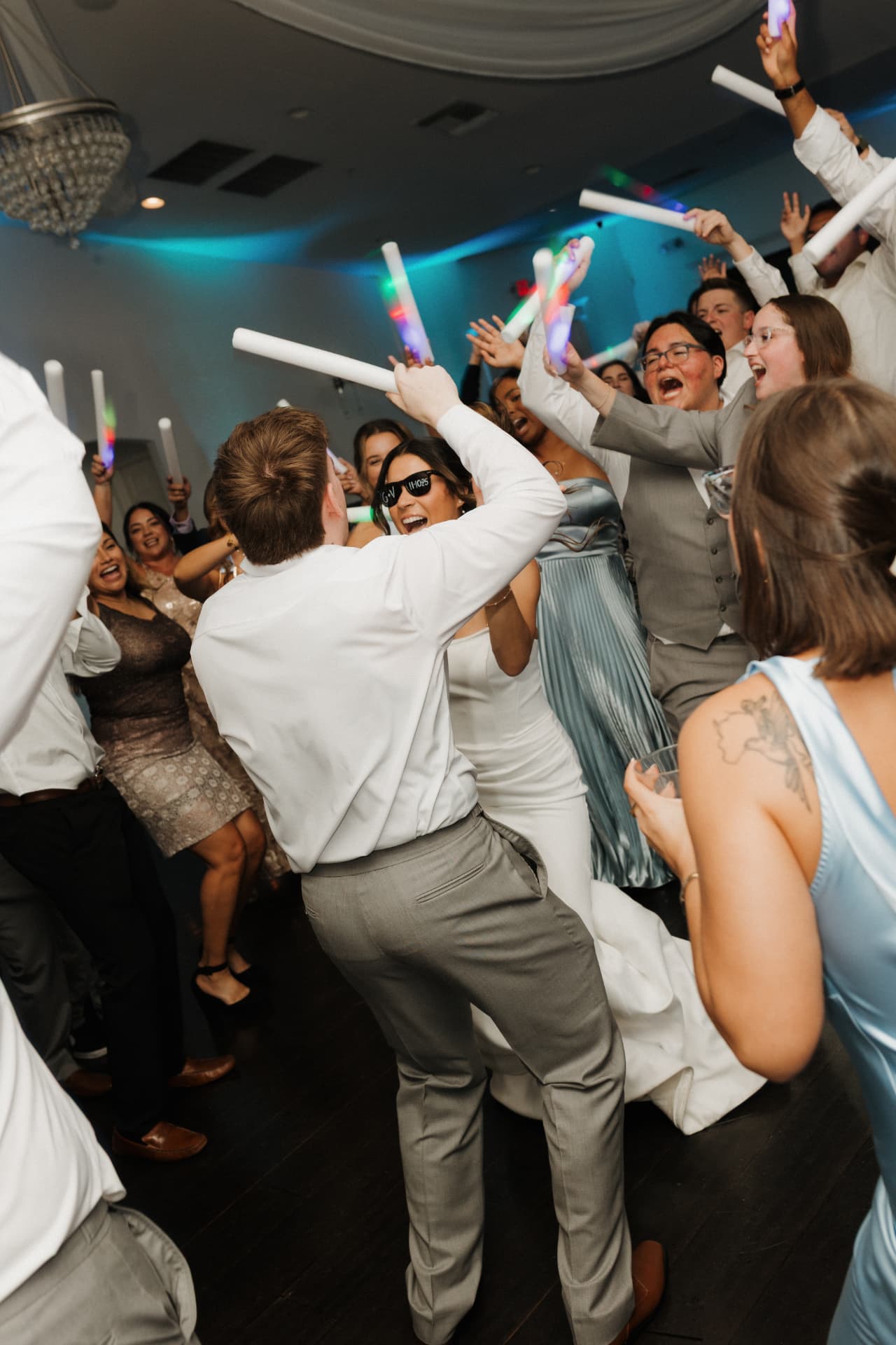 Guests laughing and dancing at a wedding reception